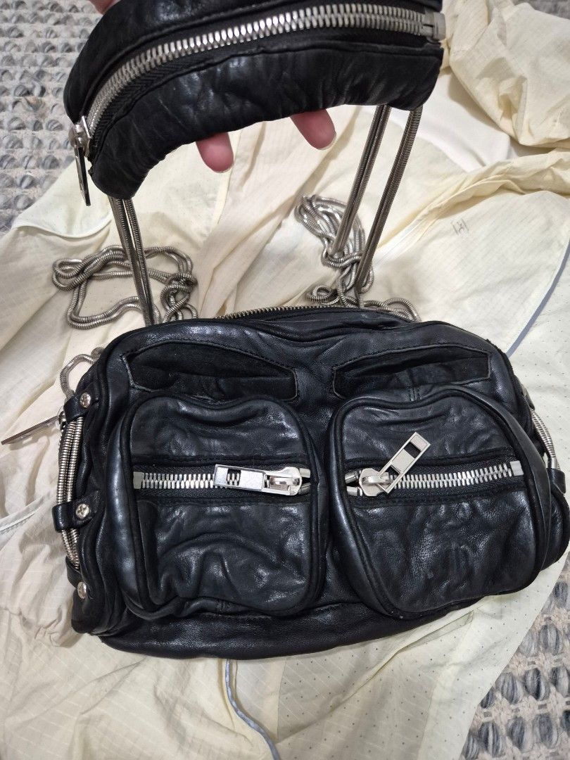 Alexander Wang Brenda multi pocket leather bag (Category: Luxury Bags & Wallets) located in Quezon City. Submitted by 53888 (Listing ID 1454919908, Image 2). Description: - Authentic Alexander Wang Brenda bag - Genuine black leather - Multi-pocket design for excellent organization - Numerous zippers and compartments - Stylish silver hardware - Chic chain strap.
