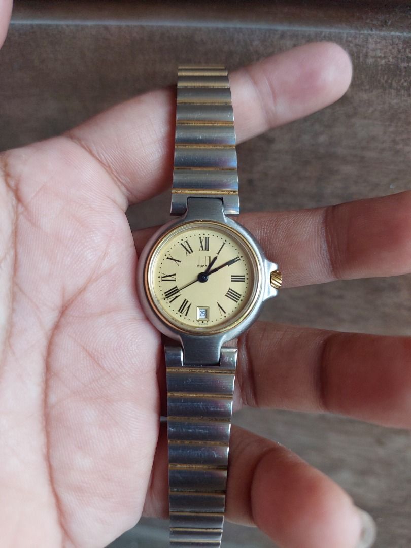 Alfred Dunhill millenium Swiss Made Quartz Watch (Category: Luxury Watches) located in Batangas. Submitted by vintageanddainty (Listing ID 1454780044, Image 2). Description: - Dunhill Swiss Made Quartz Watch - Elegant cream dial with Roman numerals - Convenient date window - Water resistant for everyday peace of mind - Durable metal strap with stylish gold accents - Ideal for daily wear.