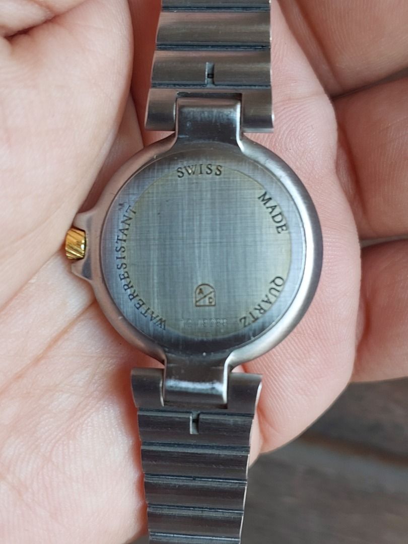 Alfred Dunhill millenium Swiss Made Quartz Watch (Category: Luxury Watches) located in Batangas. Submitted by vintageanddainty (Listing ID 1454780044, Image 3). Description: - Dunhill Swiss Made Quartz Watch - Elegant cream dial with Roman numerals - Convenient date window - Water resistant for everyday peace of mind - Durable metal strap with stylish gold accents - Ideal for daily wear.