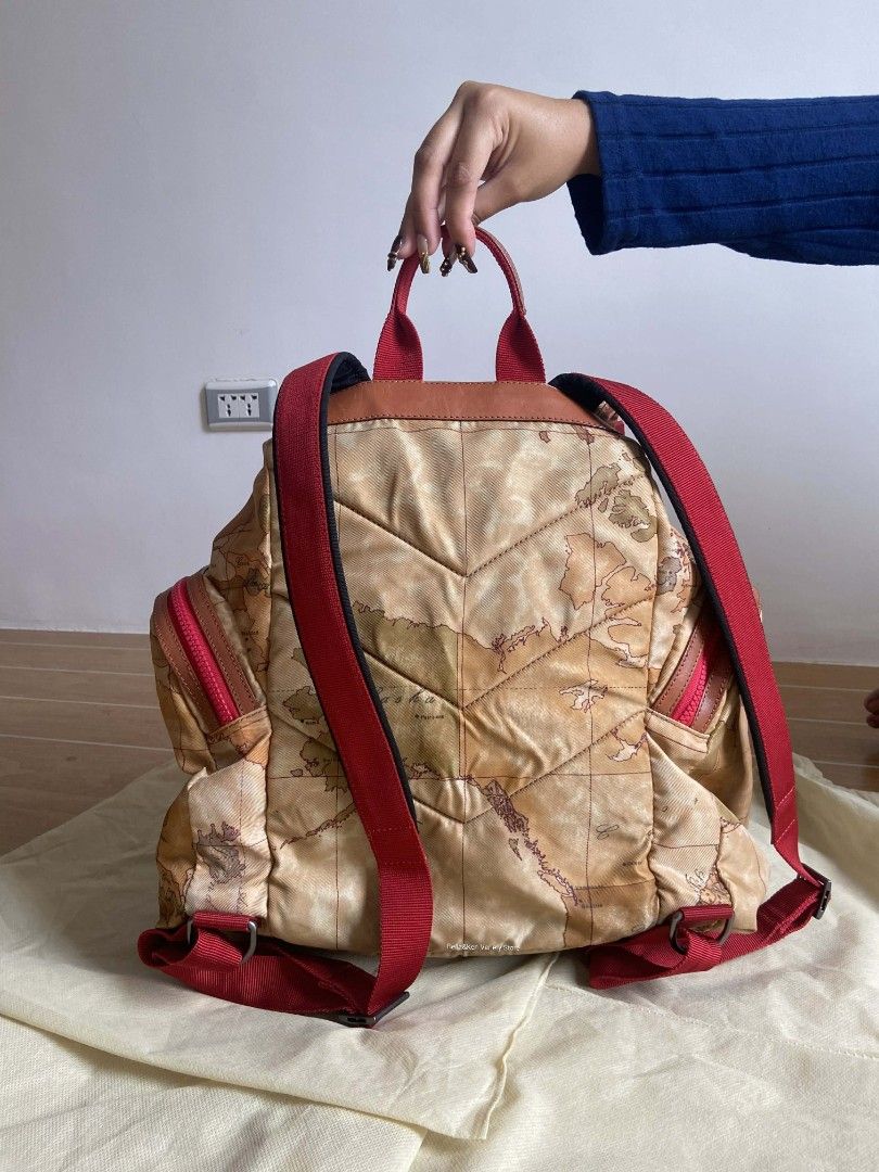 Alviero Martini 1a Classe Geo Map Backpack (Category: Luxury Bags & Wallets) located in Bulacan. Submitted by bella.ken.varietystore (Listing ID 1454866478, Image 3). Description: - Iconic Alviero Martini map print - Stylish red accents and leather trim - Spacious main compartment - Convenient front zip pockets - Adjustable straps for comfortable wear - Ideal for travel and everyday adventures - Unique and eye-catching design.