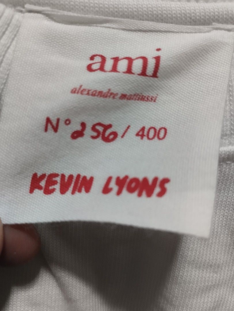 Ami Paris x Kevin Lyons t-shirt (Category: Luxury Apparel) located in Bacoor. Submitted by nigel_008 (Listing ID 1454911699, Image 2). Description: This white crewneck t-shirt from the Ami Paris x Kevin Lyons collaboration features a playful red graphic print..