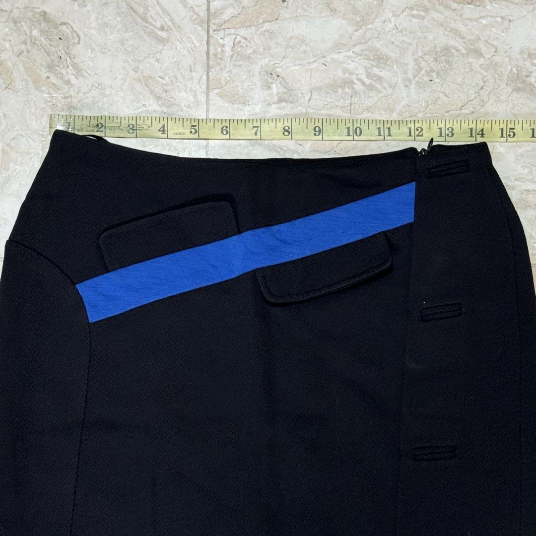 ANTEPRIMA Black Skirt with Blue Accent (Category: Skirts) located in Quezon City. Submitted by EveryWANTShop (Listing ID 1454885504, Image 2). Description: - Brand: ANTEPRIMA - Style: A-line skirt - Color: Black - Detail: Diagonal blue stripe across the front - Pockets: Two flap pockets - Closure/Details: Button details on the side - Origin: Made in Italy - Size: 40.