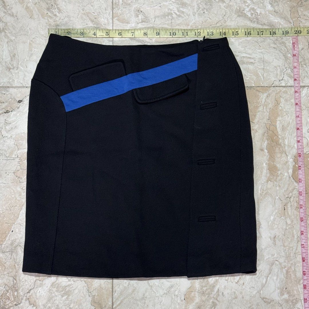ANTEPRIMA Black Skirt with Blue Accent (Category: Skirts) located in Quezon City. Submitted by EveryWANTShop (Listing ID 1454885504, Image 1). Description: - Brand: ANTEPRIMA - Style: A-line skirt - Color: Black - Detail: Diagonal blue stripe across the front - Pockets: Two flap pockets - Closure/Details: Button details on the side - Origin: Made in Italy - Size: 40.