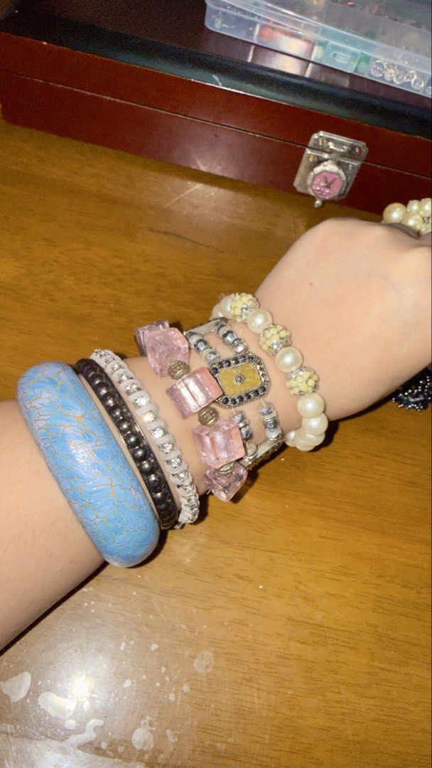 Assorted Bracelets - faux Pearls, Charms, Bangles (Category: Bracelets) located in Pilar. Submitted by faveanyshop (Listing ID 1454874824, Image 2). Description: - Bundle of assorted bracelets - Includes pearl bracelets - Charm bracelets with designs like crowns and animals - Features a blue patterned bangle - Comes with a chunky silver bracelet - Perfect for stacking or mixing and matching - Variety of styles: stretchy and bangles - Adds flair t