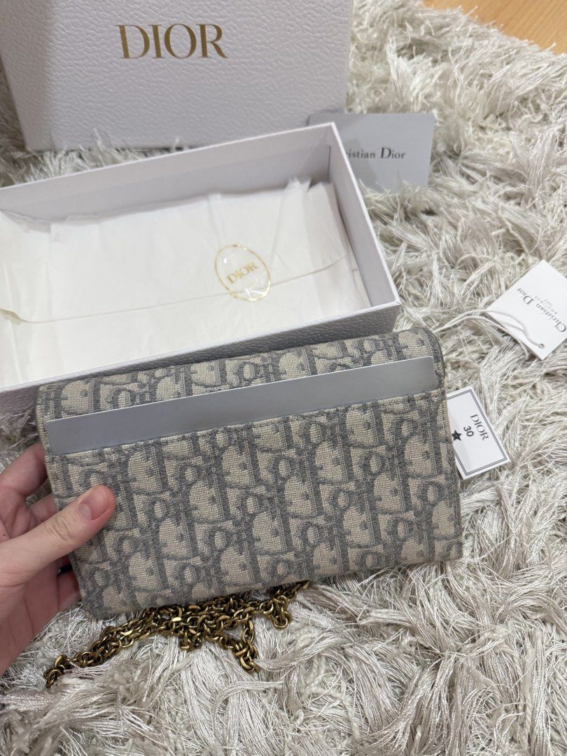FIXEDPRICE Authentic Dior Gray Oblique Saddle Wallet on Chain (Category: Luxury Bags & Wallets) located in Quezon City. Submitted by emily_in_pariss (Listing ID 1454884067, Image 2). Description: LOWEST PRICE IN THE MARKET!! FIXED PRICE Guaranteed Authentic!! Best price in carousell , includes complete set ⭐️ Rare hard to find color Purchased in Europe Current Market Price: 130,000 RFS: Too many bags, decluttering No issues/damages on the bag jus