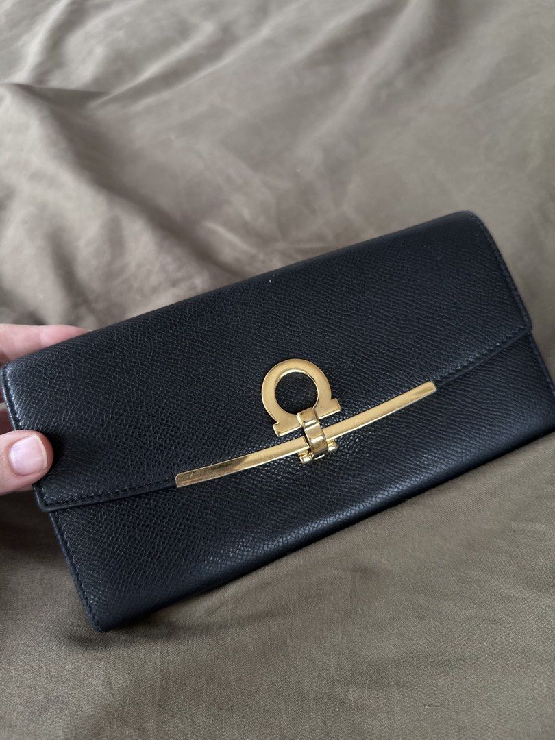 Authentic Salvatore Ferragamo wallet (Category: Luxury Bags & Wallets) located in Manila. Submitted by closetofaca (Listing ID 1454806614, Image 2). Description: Guaranteed authentic Bought in Japan Size: 7.5 x 3.75” Has leather rubs.