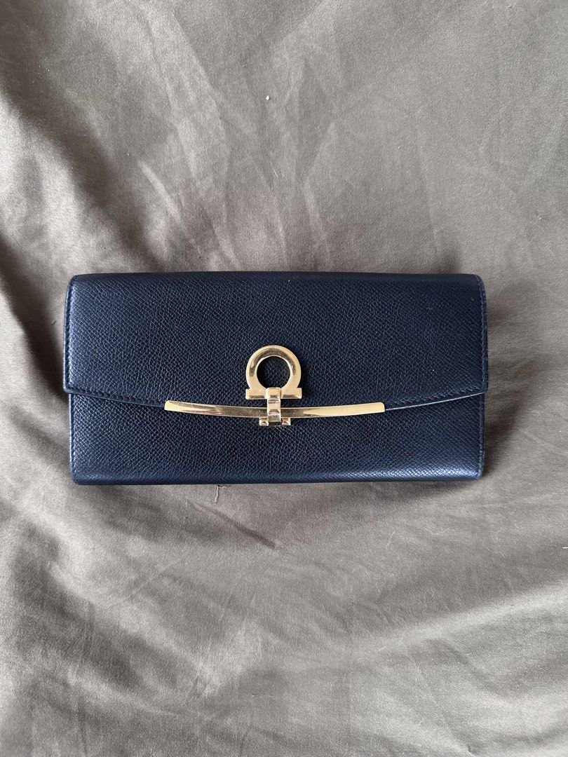 Authentic Salvatore Ferragamo wallet (Category: Luxury Bags & Wallets) located in Manila. Submitted by closetofaca (Listing ID 1454806614, Image 1). Description: Guaranteed authentic Bought in Japan Size: 7.5 x 3.75” Has leather rubs.