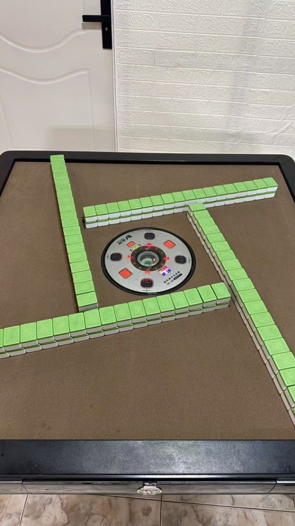 Automatic Mahjong Machine (Category: Board Games & Puzzles) located in Singapore. Submitted by keenshark.6a6e0e (Listing ID 1454893024, Image 3). Description: 148 mahjong tiles, size #42, featuring flowers and animals, suitable for Singapore mahjong. .