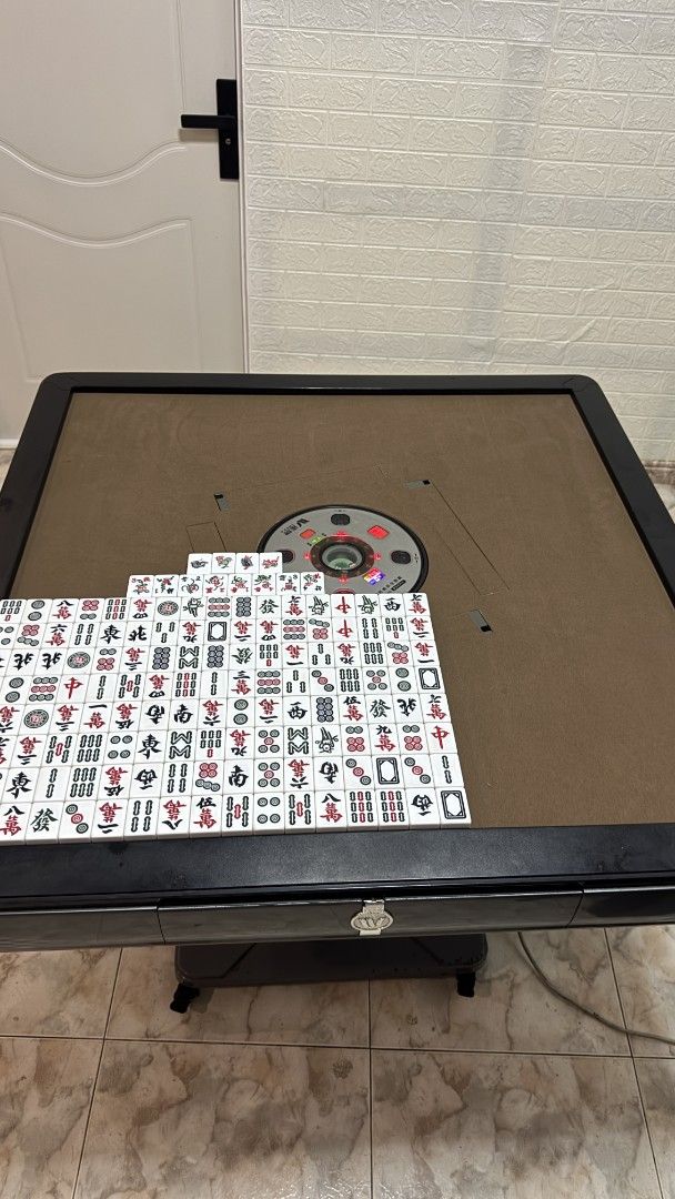 Automatic Mahjong Machine (Category: Board Games & Puzzles) located in Singapore. Submitted by keenshark.6a6e0e (Listing ID 1454893024, Image 2). Description: 148 mahjong tiles, size #42, featuring flowers and animals, suitable for Singapore mahjong. .