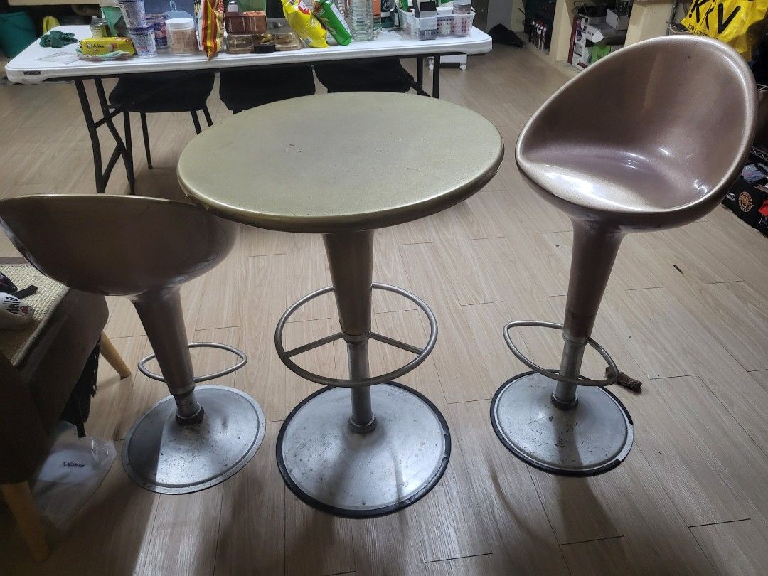 Bar Table and 2 Stools Set (Category: Tables & Sets) located in Caloocan City. Submitted by lynette1977 (Listing ID 1454939712, Image 1). Description: Selling as set for 3500. Hydraulic needs replacement, rust is evident on the lower part, rubber edges are also missing on 1 chaie and broken on the other chair. Handles for adjusting height is also missing. Bought this at Dimensione for 10k, selling for 3500 nalang..