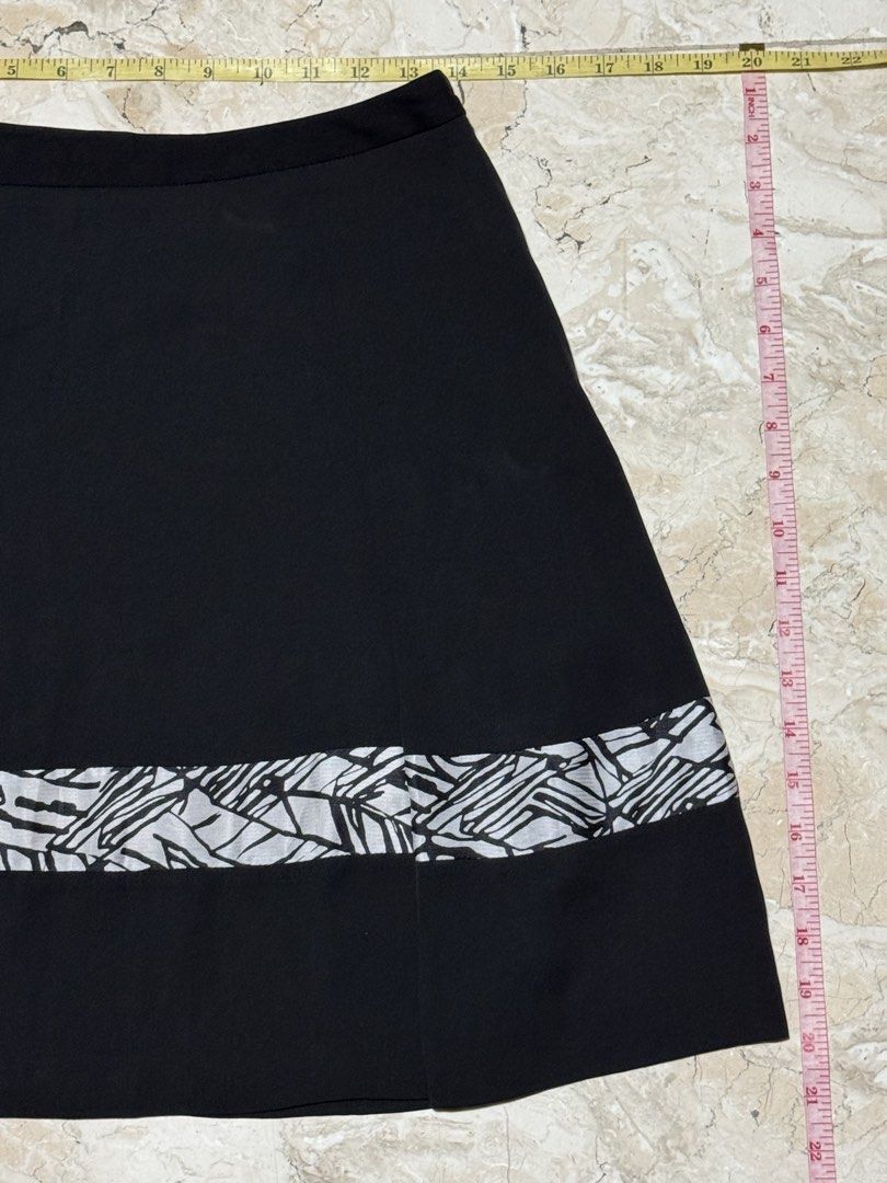 Black A-line Skirt with Geometric Hem (Category: Skirts) located in Quezon City. Submitted by EveryWANTShop (Listing ID 1454887221, Image 3). Description: - Stylish black A-line skirt - Features a cool geometric pattern at the hem - Flared design for a flattering silhouette - Versatile piece, easy to dress up or down and pair with various tops.