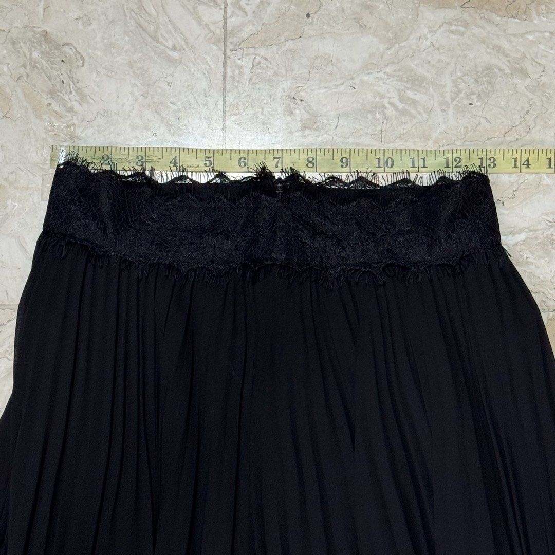 Black Lace Trim Maxi Skirt (Category: Skirts) located in Quezon City. Submitted by EveryWANTShop (Listing ID 1454886354, Image 3). Description: - Flowy black maxi skirt - Intricate lace trim at the hem with scalloped edge and fringe details - Elasticated waistband with lace detail at the top - Versatile: perfect for dressing up or down.