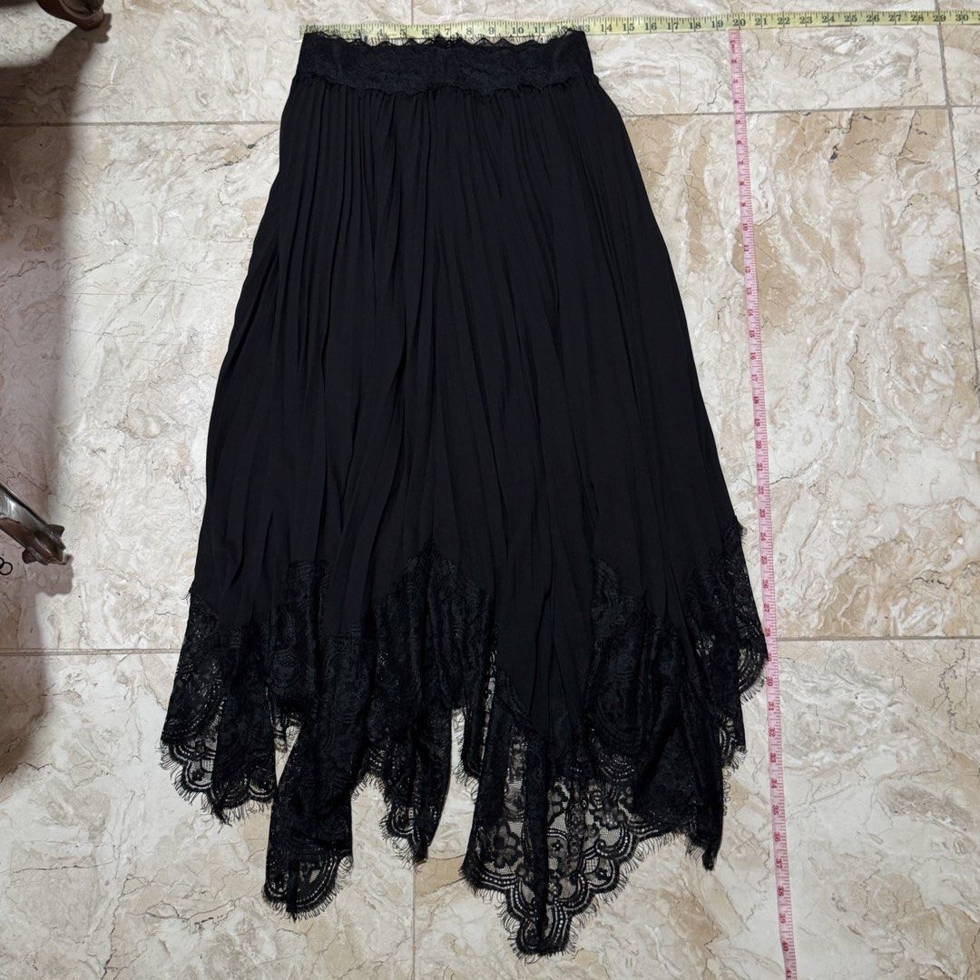 Black Lace Trim Maxi Skirt (Category: Skirts) located in Quezon City. Submitted by EveryWANTShop (Listing ID 1454886354, Image 1). Description: - Flowy black maxi skirt - Intricate lace trim at the hem with scalloped edge and fringe details - Elasticated waistband with lace detail at the top - Versatile: perfect for dressing up or down.