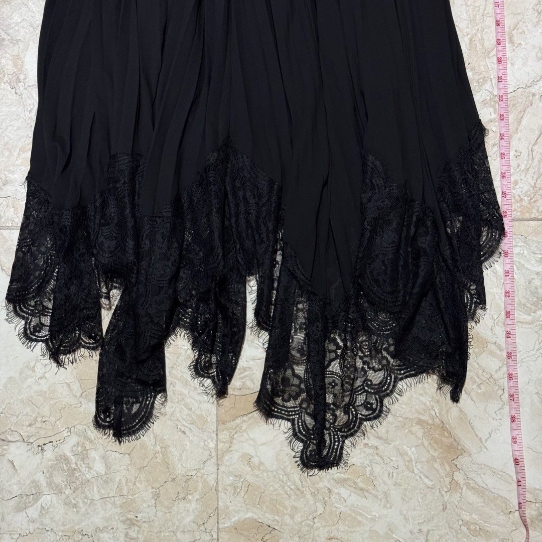 Black Lace Trim Maxi Skirt (Category: Skirts) located in Quezon City. Submitted by EveryWANTShop (Listing ID 1454886354, Image 2). Description: - Flowy black maxi skirt - Intricate lace trim at the hem with scalloped edge and fringe details - Elasticated waistband with lace detail at the top - Versatile: perfect for dressing up or down.