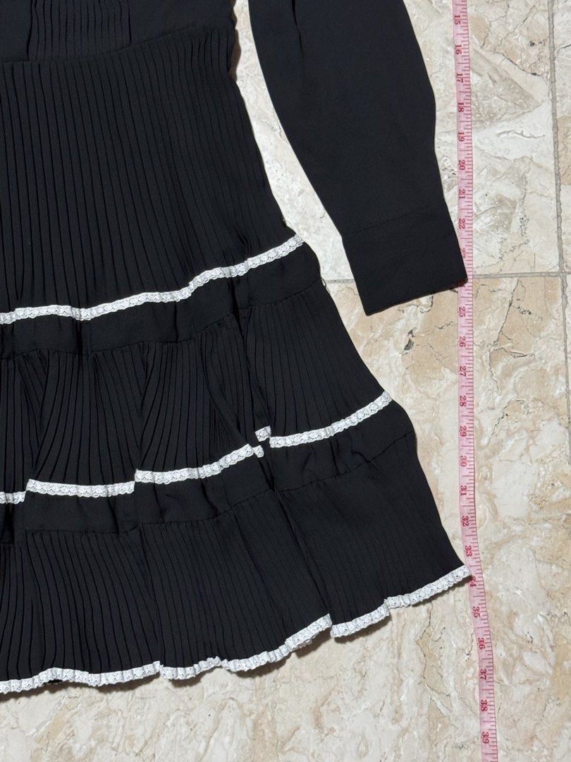 Black Long Sleeve Pleated Dress (Category: Dresses) located in Quezon City. Submitted by EveryWANTShop (Listing ID 1454889219, Image 2). Description: - Classic black long sleeve dress - Elegant collared neckline with button closure - Subtle vertical pleating on the bodice - Eye-catching prominent pleats on the skirt - Perfect for a smart casual outfit.