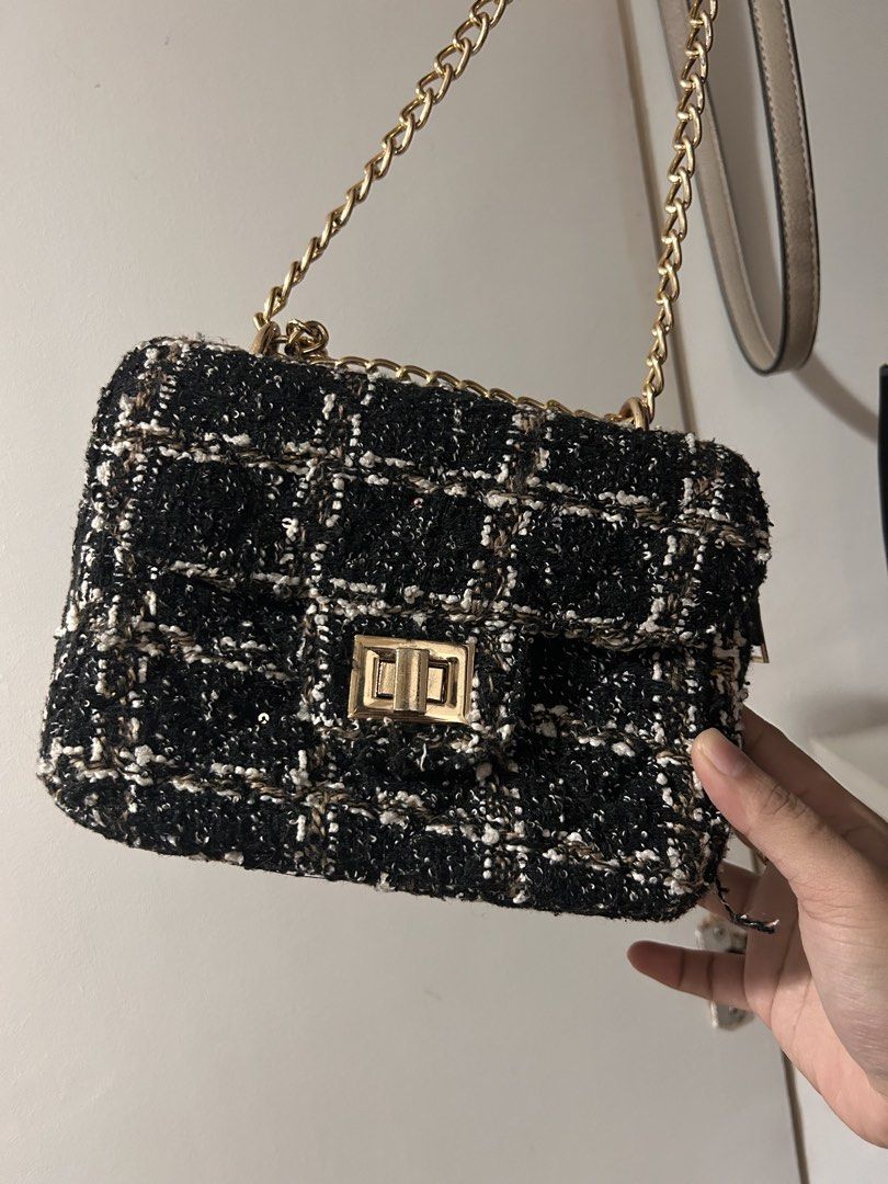 Black Tweed Chain Shoulder Bag with Gold strap (Category: Luxury Bags & Wallets) located in Manila. Submitted by n1khola1_20051606 (Listing ID 1454774624, Image 1). Description: - Cute black tweed shoulder bag - Classic checkered pattern with white and gold threads - Gold chain strap - Gold clasp closure - Interior zippered compartment - Ideal for nights out or adding flair to everyday outfits RFS: Declutter 🚚 sf/df shouldered by the buyer STILL