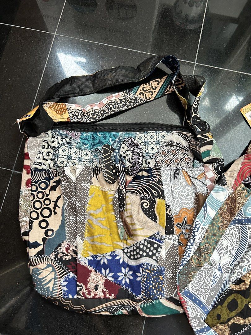Boho Batik Patchwork Shoulder Bag (Category: Shoulder Bags) located in Singapore. Submitted by authentique531 (Listing ID 1454841672, Image 2). Description: - Unique batik patchwork shoulder bags - Each bag features a distinct pattern - Secure top zipper closure - Comfortable strap for easy carrying - Ideal for everyday use or travel - Adds a vibrant touch to any outfit $12 each or make me an offer .