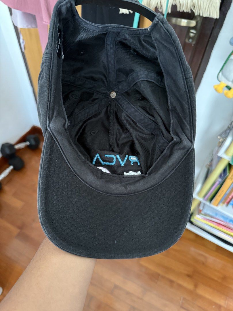 Cap (Category: Caps & Hats) located in Singapore. Submitted by zwanzainal94218 (Listing ID 1454854182, Image 3). Description: - Brand: RVCA - Type: Cap - Color: Black - Design: Features RVCA Artist Network Program logo embroidery - Fit: Adjustable strap for a customizable fit - Condition: Good, pre-loved.
