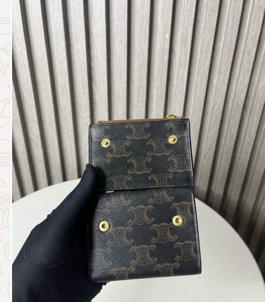 Celine Triomphe Canvas Small Wallet (Category: Luxury Bags & Wallets) located in Taguig. Submitted by almero22 (Listing ID 1454910886, Image 3). Description: - Authentic Celine small wallet - Iconic Triomphe canvas with Triomphe logo hardware - Practical design with a zip pocket and card slots - Elegant brown and black colorway.