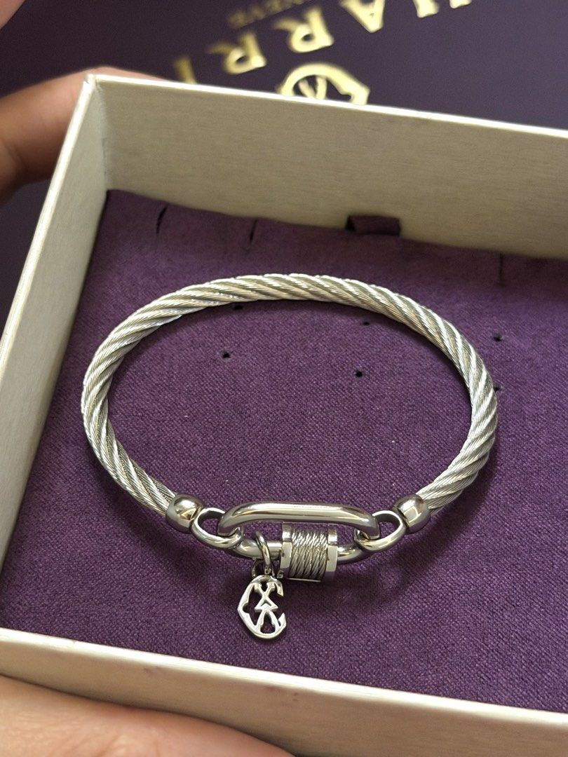 Charriol Cable Bracelet with Charm and Ring (Category: Bracelets) located in Mandaluyong City. Submitted by treasureeverythingph (Listing ID 1454892574, Image 2). Description: - Authentic Charriol cable bracelet 12k - Signature twisted cable design - Carabiner-style clasp - Silver-tone metal - Comes with original box -ring 5k Mandaluyong .