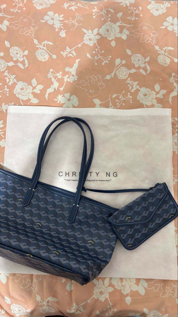 Christy Ng Navy Monogram Tote Bag with Pouch (Category: Tote Bags) located in Binan City. Submitted by franchescalavina (Listing ID 1454903072, Image 1). Description: - Navy blue Christy Ng tote bag (dupe) - Features signature monogram pattern - Comes with a matching smaller pouch inside - Interior is lined with canvas - Small mark inside the bag (shown in the last photo) - Great for everyday use.