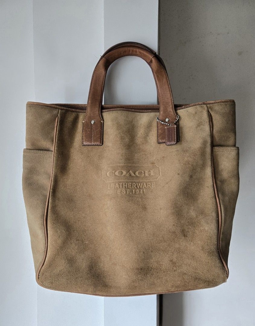 Coach Large Suede Tote Bag (Category: Luxury Bags & Wallets) located in Mandaluyong City. Submitted by mark.gats (Listing ID 1454885493, Image 1). Description: - Authentic Coach brown suede tote bag - Genuine leather trim and handles - Embossed 'Coach Leatherware Est. 1941' logo on the front - Interior tag confirms 'Coach. Handcrafted in China from fine split suede leather, trimmed with genuine leather.' - Serial Number: N°F3S-5995 With visible w
