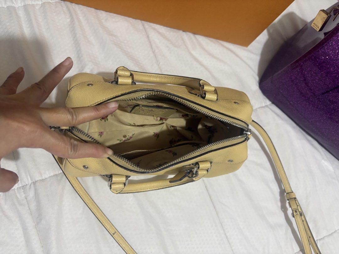 Coach Pebble Leather Satchel Bag Yellow (Category: Luxury Bags & Wallets) located in Manila. Submitted by nykji96 (Listing ID 1454808066, Image 2). Description: - Genuine Yellow Coach Satchel Bag - Durable Pebble Leather Texture - Secure Zip Closure - Spacious Interior with Multiple Compartments - Chic Floral Lining - Includes Detachable Shoulder Strap - Ideal for Everyday Carry.