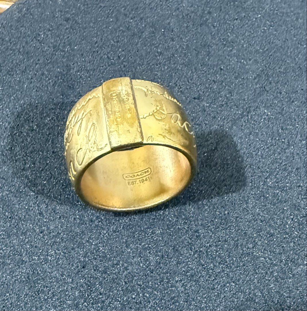 Coach Ring (Category: Rings) located in Singapore. Submitted by i.leen (Listing ID 1454848044, Image 3). Description: Well used and kept in storage. It’s tarnished especially at the bottom of the shank. Due to this, it looks vintage. 😁 Pictures do not reflect exact color. It’s not as “yellow” in reality. Pls chat only if you’re comfortable with it. Tks .
