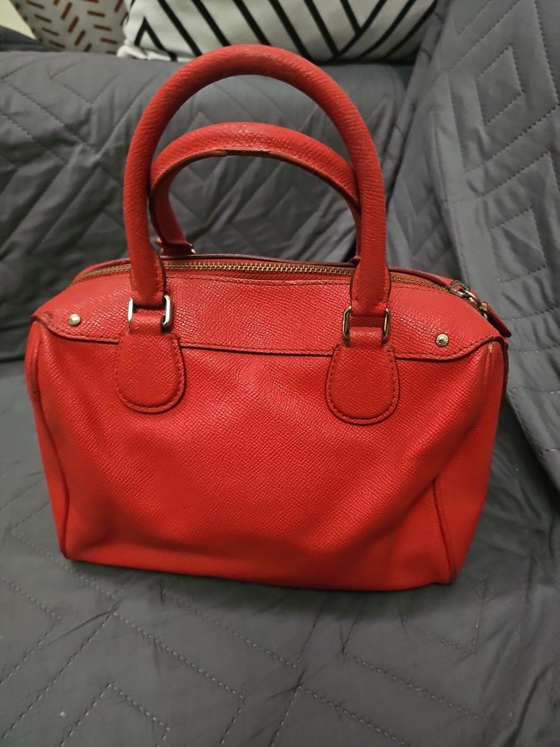 Coach Rowan Satchel in Red (handbag) (Category: Shoulder Bags) located in Manila. Submitted by shopaholicmimi (Listing ID 1454938237, Image 2). Description: ✨ PRODUCT DETAILS: - Brand: COACH - Model: Rowan Satchel - Material: Durable crossgrain leather with fabric lining - Hardware: Silver-tone - Dimensions: 10" (L) x 6.5" (H) x 5.5" (W) - Features: Top handles (4.25" drop), zip-top closure, exterior front zip pocket, interior zip & multifunction