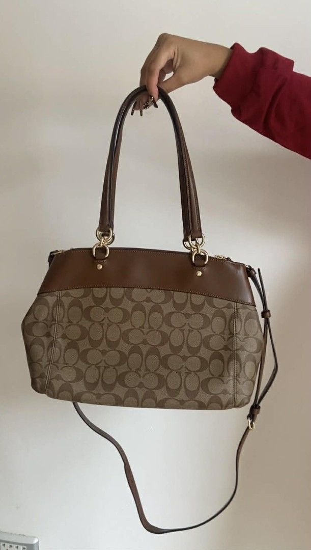 Coach Signature Monogram Brown Leather Shoulder Bag (Category: Luxury Bags & Wallets) located in Bulacan. Submitted by bella.ken.varietystore (Listing ID 1454868021, Image 2). Description: Classic Coach monogram shoulder bag. Brown signature canvas with leather trim. Gold hardware details. Top zip closure. Has a detachable crossbody strap. Plenty of space inside for your essentials. Great everyday bag..