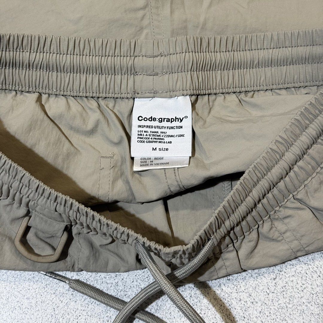 Codegraphy Nylon Shorts (Category: Shorts) located in Singapore. Submitted by friendlyneighbor_k (Listing ID 1454874069, Image 3). Description: * Lightweight and comfortable for everyday wear * Durable nylon material * Water-repellent / splash-resistant fabric * Quick-drying and easy to care for * Relaxed fit with a practical, comfortable length * Great for casual wear, travel, outdoor activities, or daily use * Simple, versatile design that’s ea