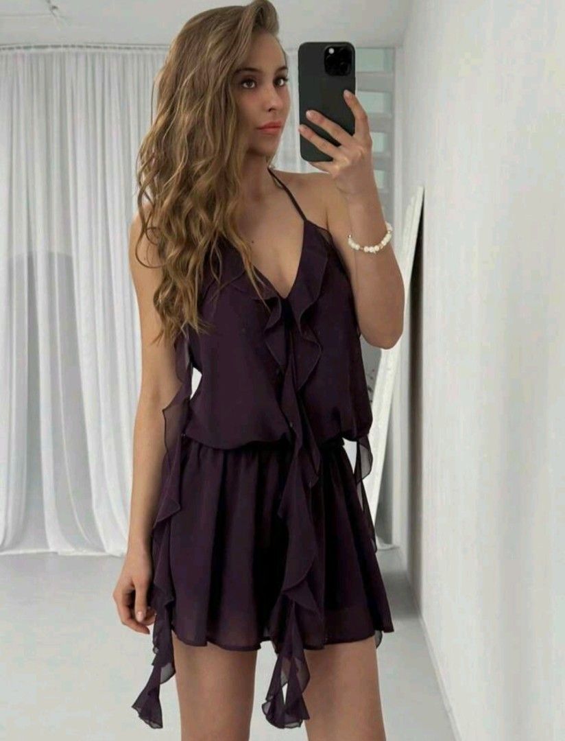 Dark Purple Ruffle Halter Neck Mini Dress (Category: Dresses) located in Manila. Submitted by monaaa03 (Listing ID 1454942883, Image 1). Description: - Brand new/never worn -Cute dark purple mini dress - Halter neck with front ruffles - Open back with tie detail - Flowy skirt with ruffled hem - Lightweight material - Ideal for parties or a night out.