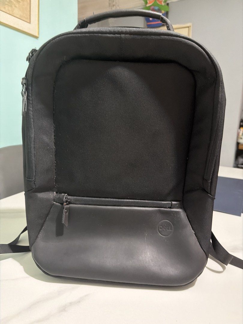 Dell Backpack (Category: Backpacks) located in Singapore. Submitted by ms.maffins (Listing ID 1454784271, Image 1). Description: - Unused Dell laptop backpack - Fits laptops up to 15 inches - Durable black fabric with a stylish faux leather base - Features the iconic Dell logo - Ideal for work, school, or travel.