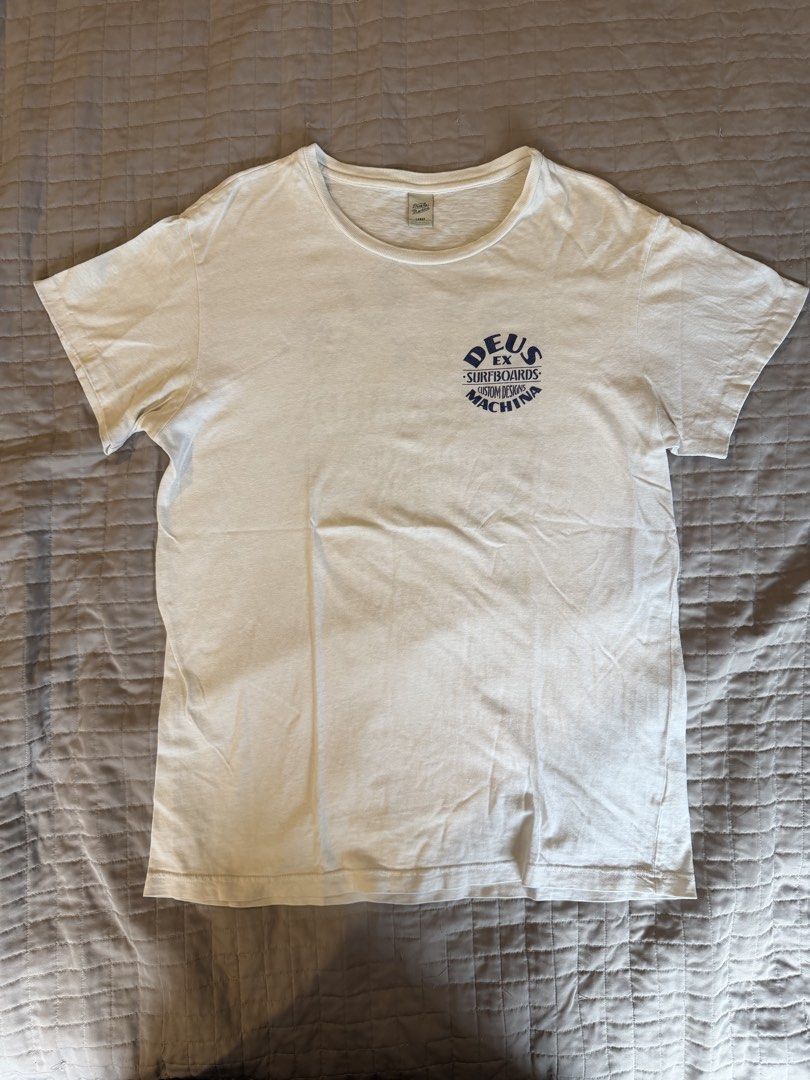 Deus Ex Machina Surfboards White Tshirt (Category: Tshirts & Polo Shirts ) located in Quezon City. Submitted by harringtonmnl (Listing ID 1454862635, Image 2). Description: Deus Ex Machina Surfboards Tshirt White color with Blue text Dimes 21 x 29 Large size For Surfers and Bikers.