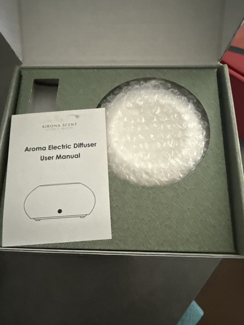Electric diffuser burner (Category: Home Fragrance) located in Singapore. Submitted by whyliveonce (Listing ID 1454802443, Image 1). Description: - Electric aroma diffuser by Kirona Scent - Comes with user manual - Includes a small bottle of fragrance oil - Creates a pleasant atmosphere - Easy to use.