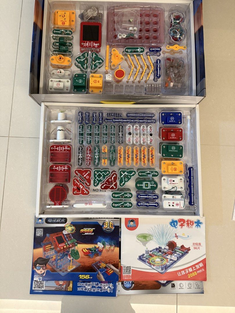 Electronic Bricks (Category: Lego & Building Sets) located in Singapore. Submitted by mommysui (Listing ID 1454913484, Image 2). Description: - Fun electronic bricks set for kids - Build various models like houses and cars - Includes 156 pieces - Encourages invention and creativity - Great for learning about circuits - Helps children fall in love with invention - similar to snap circuit Lightly used, got it at $75, willing to let go at $50 Take n