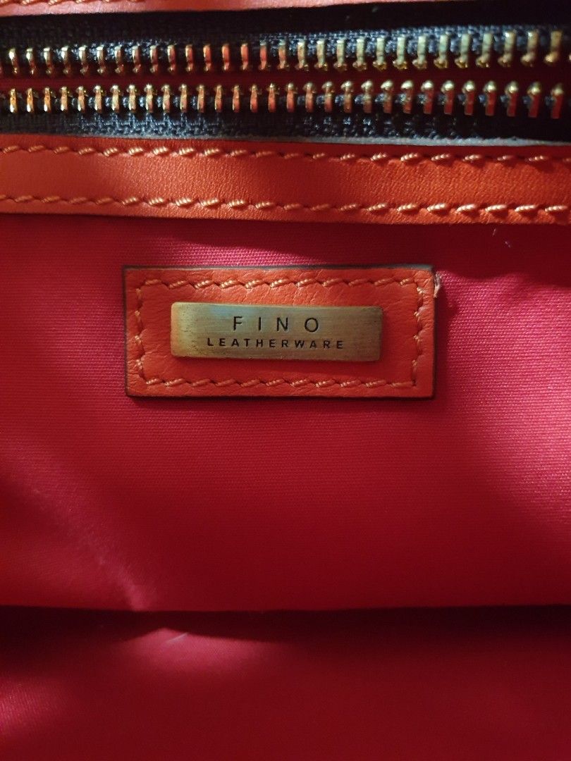FINO ORANGE LEATHER BAG (Category: Shoulder Bags) located in Manila. Submitted by niknak35503 (Listing ID 1454868363, Image 2). Description: - Orange leather bag with sling - Original Fino bag.