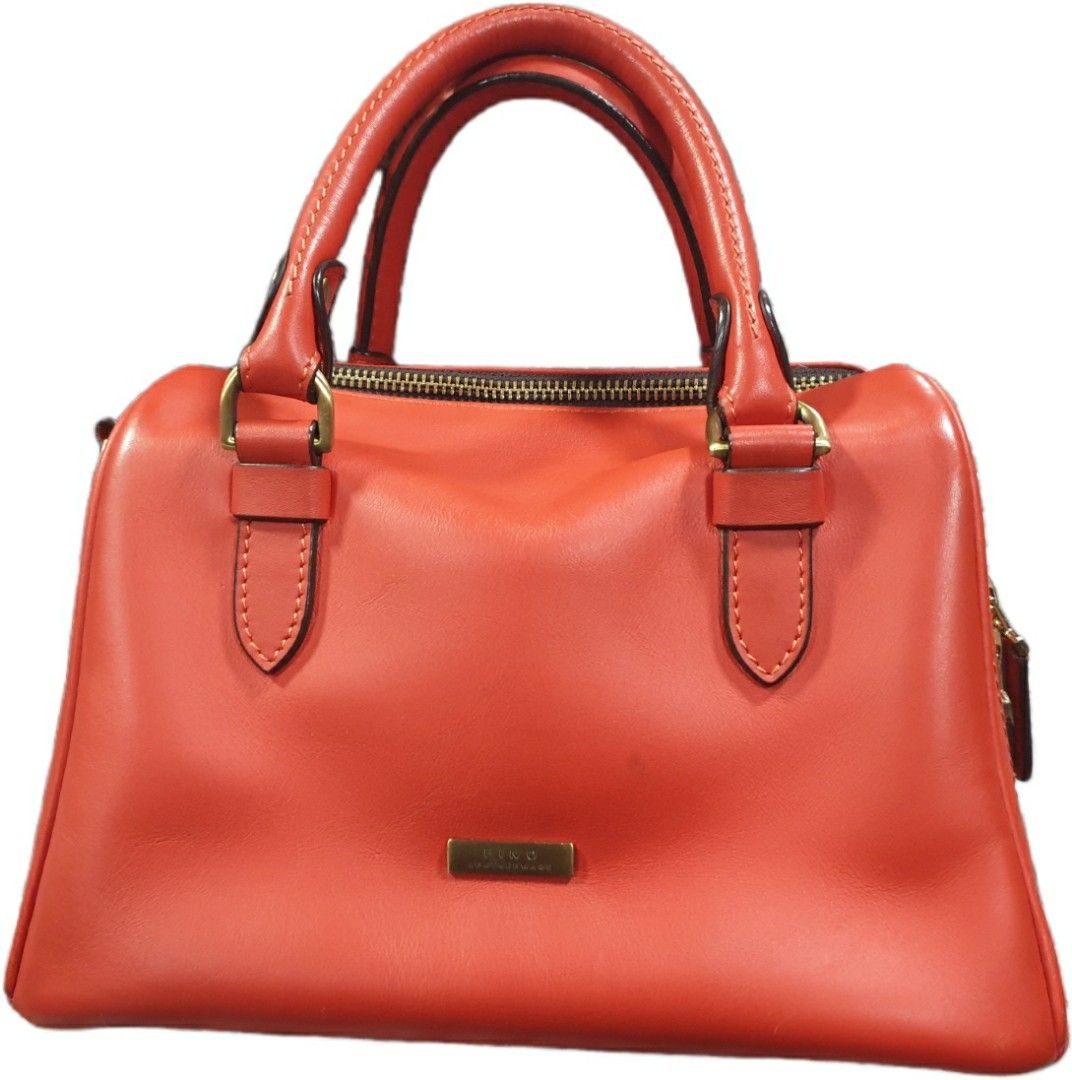 FINO ORANGE LEATHER BAG (Category: Shoulder Bags) located in Manila. Submitted by niknak35503 (Listing ID 1454868363, Image 1). Description: - Orange leather bag with sling - Original Fino bag.