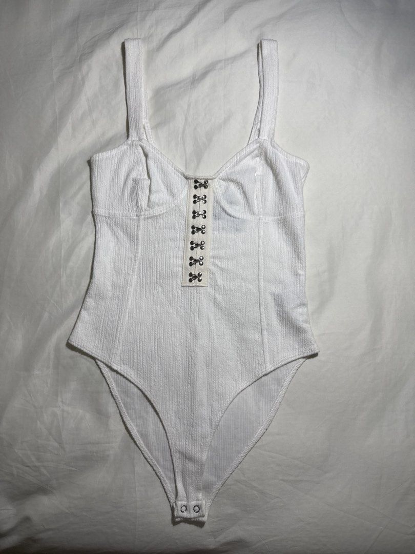 Forever 21 White Ribbed Hook and Eye Bodysuit - Size M (Category: Others Tops) located in Quezon City. Submitted by minispirea (Listing ID 1454848622, Image 1). Description: Brand new / never used but no more tag • On hand & ready to ship • More photos/videos available upon request • Pay as you order • No returns or exchanges Location: Quezon City / BGC Delivery: • Weekdays — same-day evening or next-day delivery due to work • Weekends — anytime 