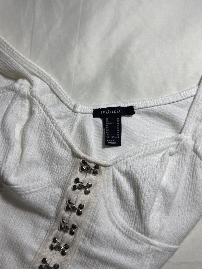 Forever 21 White Ribbed Hook and Eye Bodysuit - Size M (Category: Others Tops) located in Quezon City. Submitted by minispirea (Listing ID 1454848622, Image 3). Description: Brand new / never used but no more tag • On hand & ready to ship • More photos/videos available upon request • Pay as you order • No returns or exchanges Location: Quezon City / BGC Delivery: • Weekdays — same-day evening or next-day delivery due to work • Weekends — anytime 