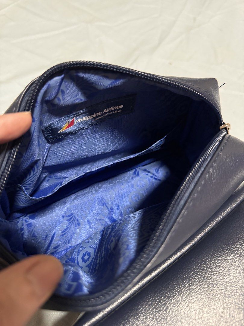 Furla x PAL pouch only (Category: Purses & Pouches) located in Marikina City. Submitted by 1stuffshop (Listing ID 1454871493, Image 3). Description: - Authentic Furla x Philippine Airlines collaboration pouch - Elegant navy blue color - High-quality material with subtle Furla branding - Unique Philippine Airlines patterned interior lining - Perfect for makeup, travel, or daily organization.