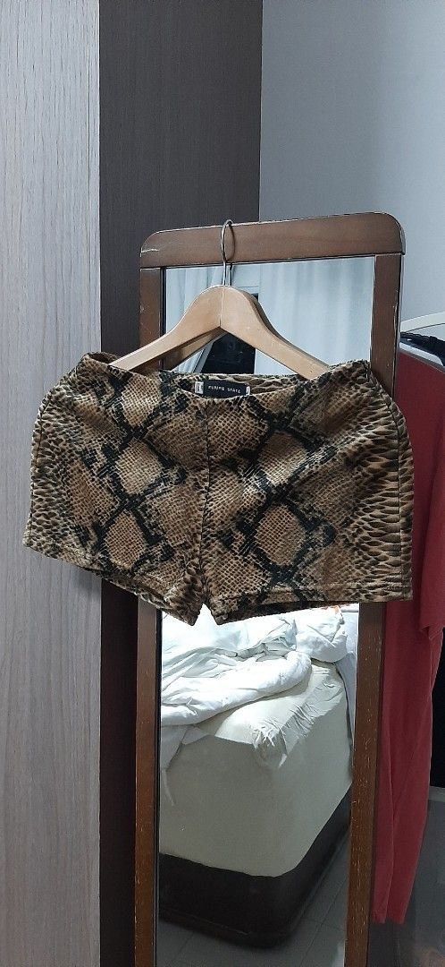 Future State (Category: Shorts) located in Singapore. Submitted by enjoyourlife (Listing ID 1454891294, Image 1). Description: - Brand: Future State - Size: L (UK 12 / US 8) - Design: Eye-catching snake print - Condition: Great, pre-loved(wore once) - Style: Trendy and edgy waist across 34cm length 28cm Imo it can fit medium. Material is like velvet..soft to touch & cooling from the inside..