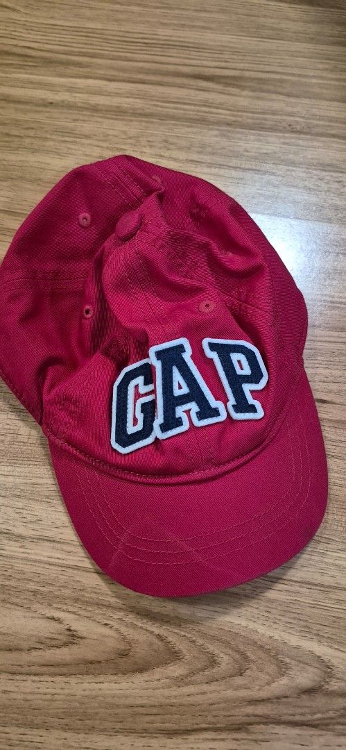 Gap Red Baseball Cap (Category: Babies & Kids Fashion) located in Pasig City. Submitted by decluttermyclosetph (Listing ID 1454874541, Image 1). Description: - Classic Gap baseball cap - Embroidered Gap logo on front - Made from 100% cotton - Size S/M (fits 52cm-56cm) - Ideal for kids or smaller adults - Great for sun protection.