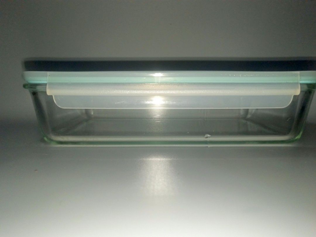 Glass Food Container with Airtight Lid (Category: Food Organization & Storage) located in Quezon City. Submitted by eyesellgoodthings (Listing ID 1454895887, Image 3). Description: - Rectangular glass food storage container - Light blue and white airtight lid with 4 secure clips - Ideal for storing leftovers and meal prepping - Easy-to-clean glass base - Stackable design for space-saving storage.
