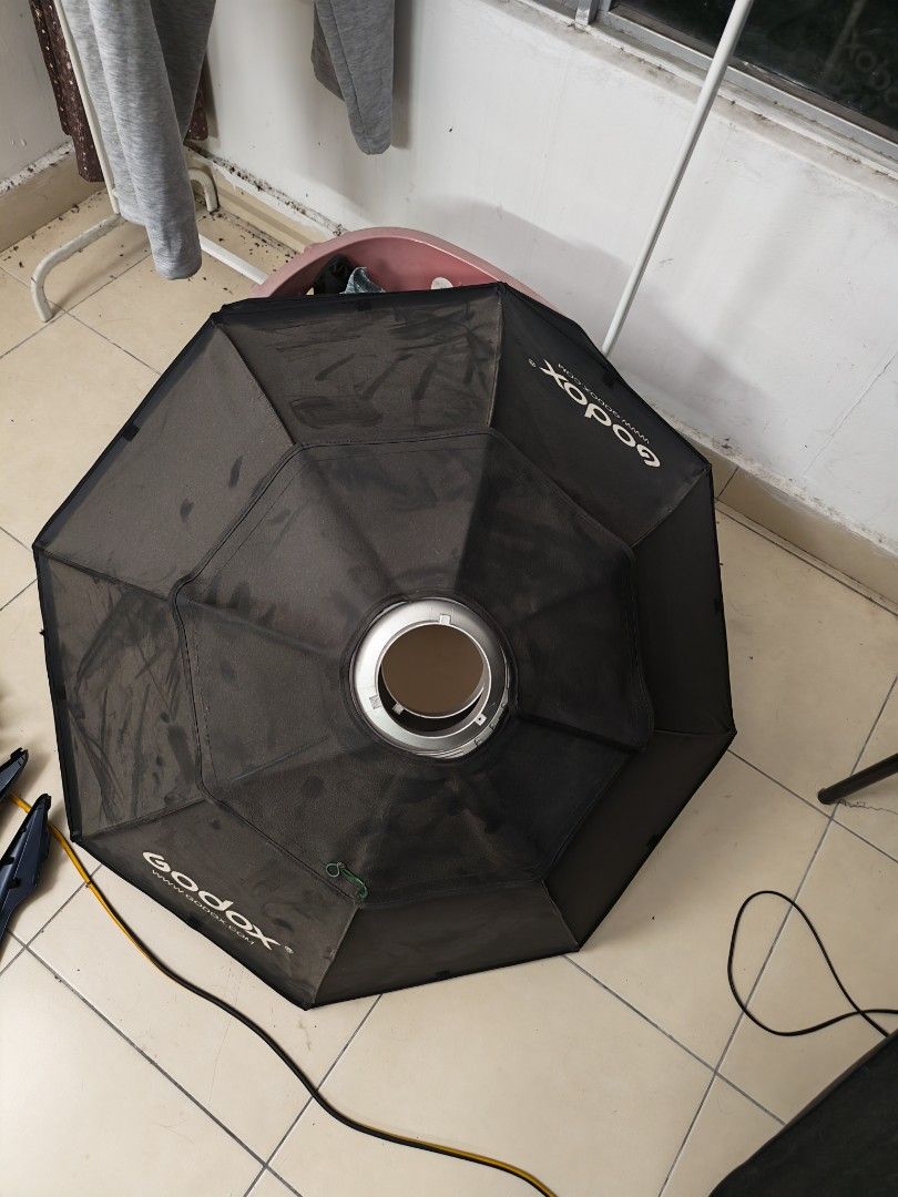 Godox Octagonal Softbox with Diffuser (Category: Lighting & Studio Equipment) located in Kamunting. Submitted by azizam97 (Listing ID 1454875659, Image 3). Description: - Godox Octagonal Softbox - Ideal for studio lighting setups - Comes with outer diffuser - Silver interior for maximum reflectivity - Easy to set up and use - Selling as I'm upgrading my gear - Feel free to ask any questions! 85cm Studio Light softbox Bowen octagon Market price RM