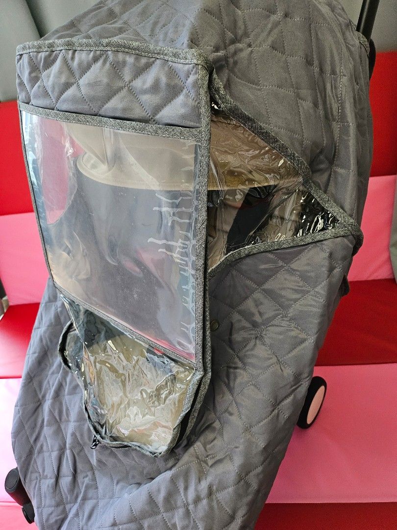 Grey Quilted YOYO Stroller Winter Cover (Category: Strollers) located in Manila. Submitted by ashleypark2019 (Listing ID 1454860005, Image 3). Description: YOYO stroller winter cover Very useful for cold climates and winter travel abroad. Provides wide coverage to help protect your baby from cold air and wind. Features a clear front viewing window, allowing you to easily check on your baby. The clear window still has its original protective film 