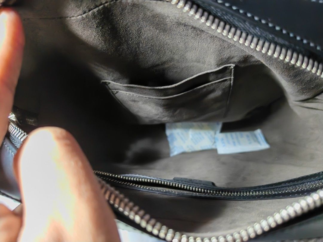 Gucci Black Leather GG Embossed Messenger Bag (Category: Luxury Bags & Wallets) located in Quezon City. Submitted by mike525 (Listing ID 1454933159, Image 3). Description: - Authentic black leather Gucci messenger bag - All-over GG embossed pattern - Zip closure on top - Front zip pocket - Interior small pouch Features a rectangular messenger silhouette with an adjustable strap for crossbody wear. - With Silver tone Hardware - Comes with authenti