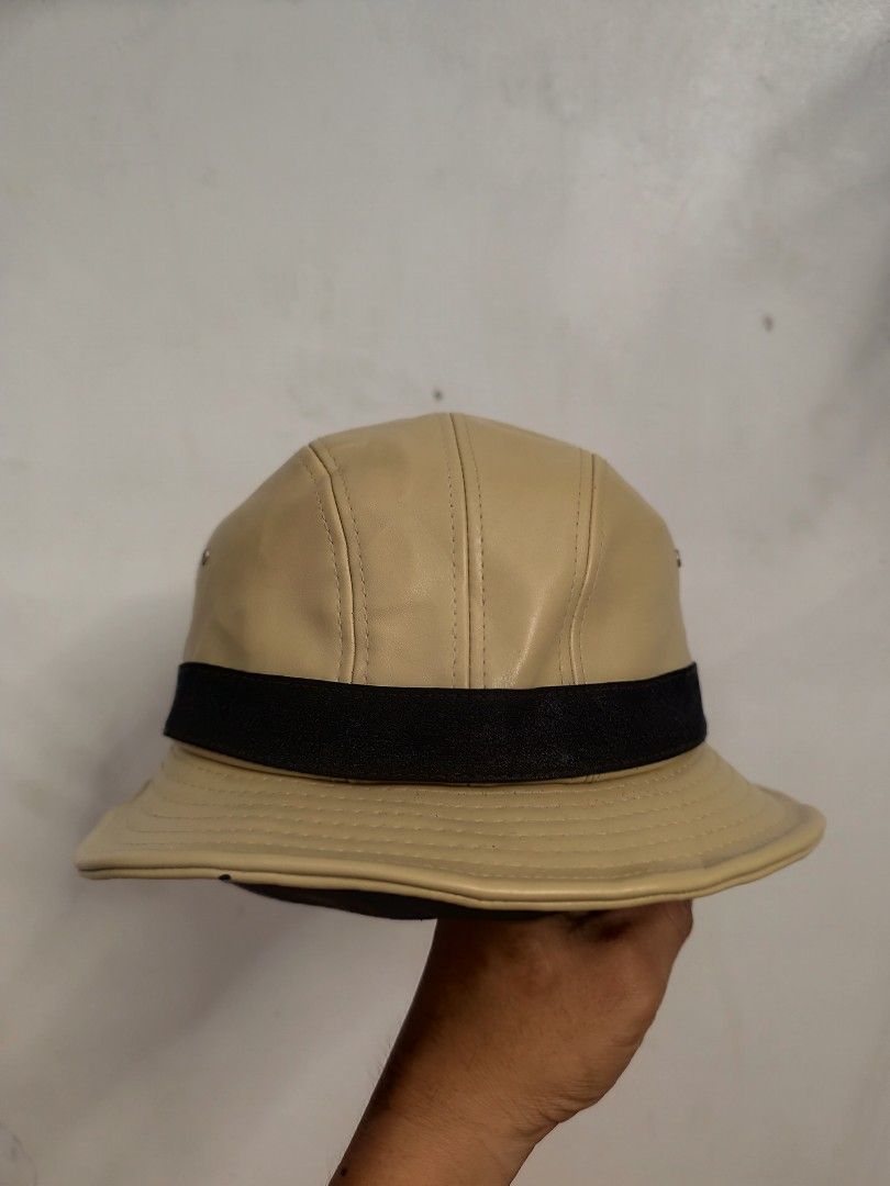 Gucci Bucket Hat Beige Leather (Category: Luxury Accessories) located in Cordova. Submitted by bsb.streetluxvintage.clothing (Listing ID 1454752864, Image 3). Description: - Authentic Gucci bucket hat - Beige leather material - Black and striped band detail - Made in Italy - Minor marks on interior - Perfect accessory for any outfit.