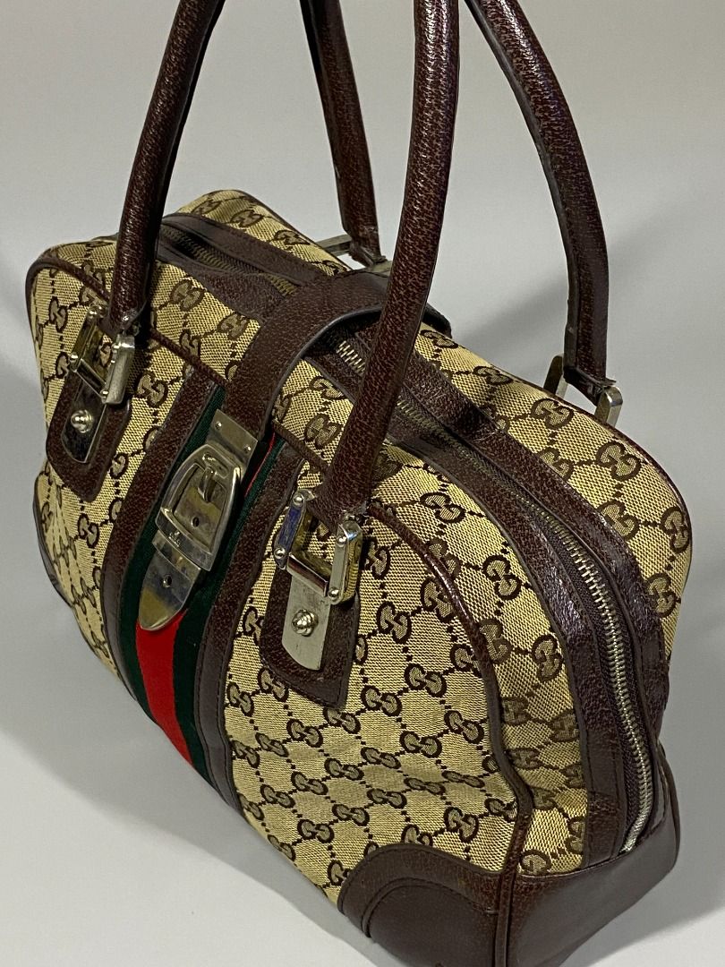 ‘GUCCI MONOGRAM HANDBAG’ (Category: Luxury Bags & Wallets) located in San Jose. Submitted by retro.co (Listing ID 1454884085, Image 3). Description: ‘GUCCI MONOGRAM HANDBAG’ •Excellent Condition •Flaws: SIGN OF USAGE ON ITS HANDLE(DM FOR INFO) • CANVAS MATERIAL AND LEATHER HANDLE • EMBLEM ON ITS PULLER READ BEFORE PURCHASING -Sure Buyers only. -You are given 1-2 days to settle your payment..