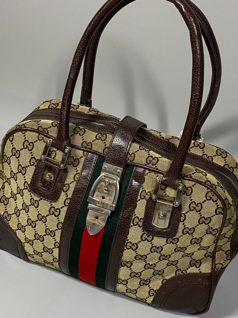 ‘GUCCI MONOGRAM HANDBAG’ (Category: Luxury Bags & Wallets) located in San Jose. Submitted by retro.co (Listing ID 1454884085, Image 2). Description: ‘GUCCI MONOGRAM HANDBAG’ •Excellent Condition •Flaws: SIGN OF USAGE ON ITS HANDLE(DM FOR INFO) • CANVAS MATERIAL AND LEATHER HANDLE • EMBLEM ON ITS PULLER READ BEFORE PURCHASING -Sure Buyers only. -You are given 1-2 days to settle your payment..
